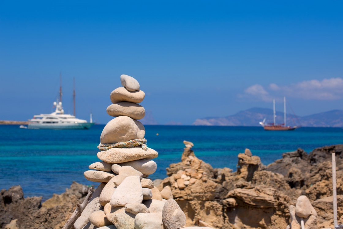 'Stone figures on beach shore of Illetes beach in Formentera Mediterranean Balearic Islands' - Balearic Islands